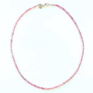 Beautiful, handcrafted 2mm round faceted Pink Amethyst semi-precious stone necklace; elegant on its own or with a pendant/charm, and perfect for layering; adorned with .925 sterling silver Jai Style hand-embossed charm and lobster clasp; necklace measures 16".