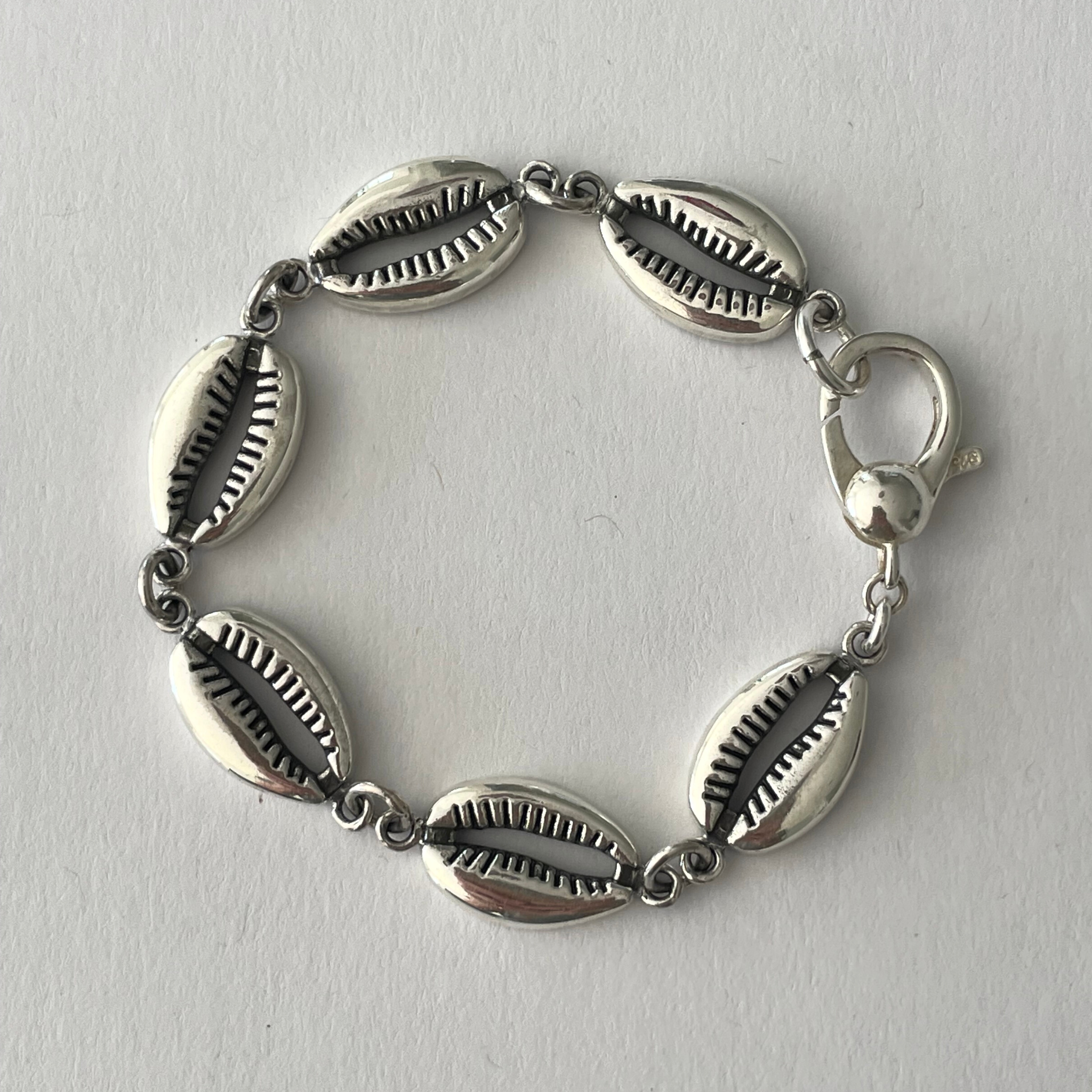 Cowrie shell necklace silver on sale