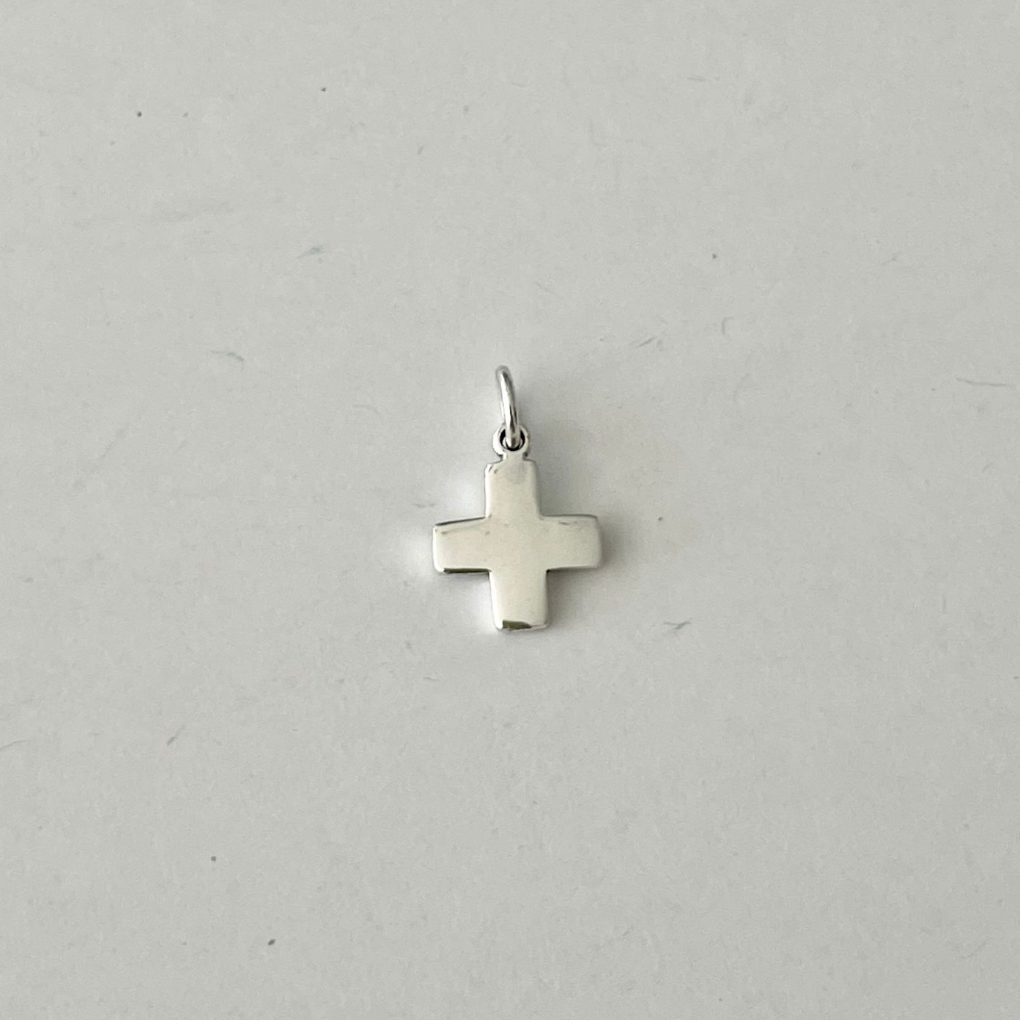 Perfect .925 solid sterling silver Small Cross Charm. Charming on a necklace or bracelet; add it to a charm ring to customize your look; coordinate it with other charms to reflect your personal style and story.