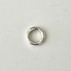 Beautiful and versatile .925 solid sterling silver round charm ring/clasp. Wear it on the front, hide it on the back, or personalize your necklace with multiple charms or a pendant.