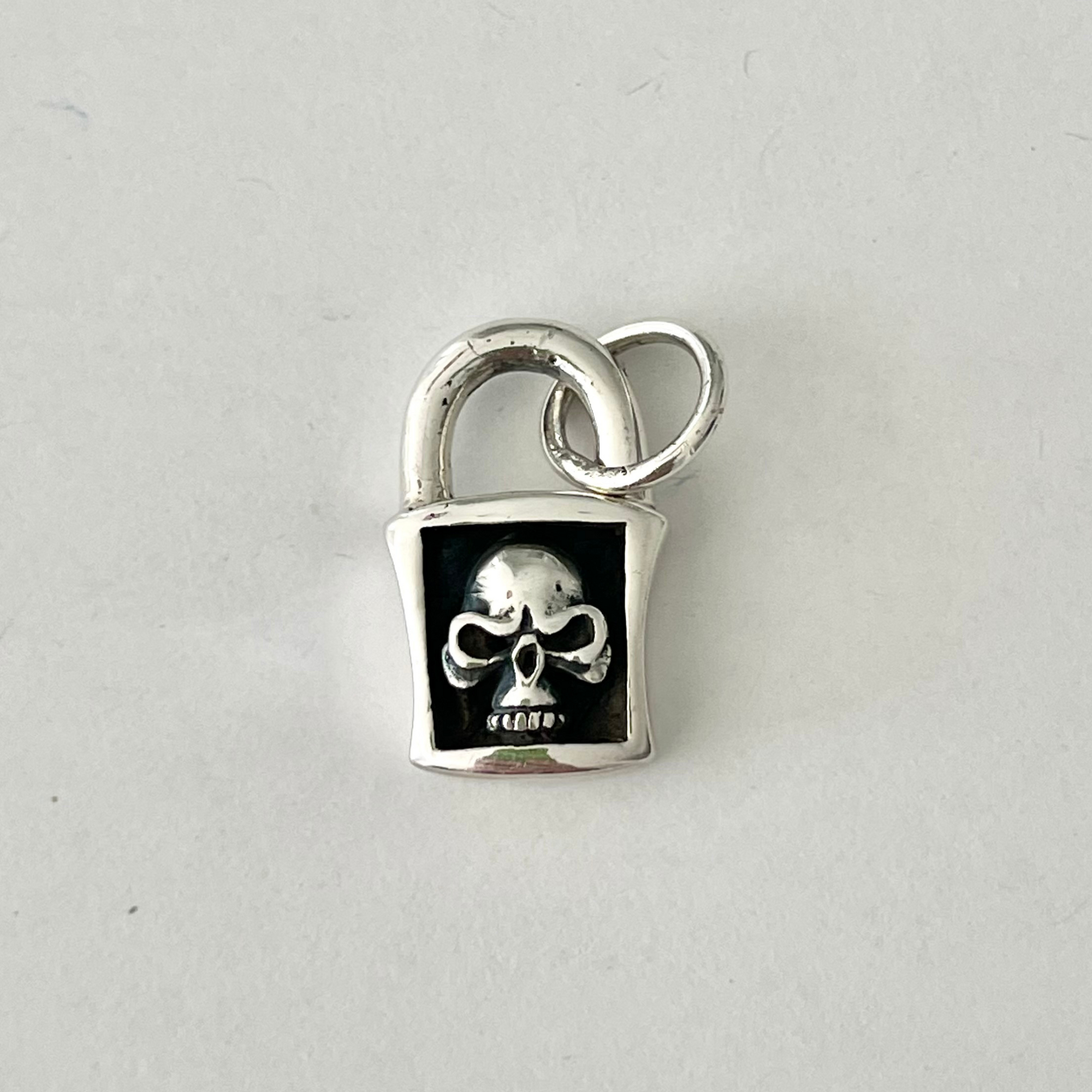 Perfect .925 solid sterling silver Skull Charm. Charming on a necklace or bracelet; add it to a charm ring to customize your look; coordinate it with other charms to reflect your personal style and story.