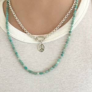 Beautiful, 4mm square cut faceted Amazonite semi-precious stones are hand-knotted with silk thread and finished with a sterling silver Jai Style charm clasp; can be worn with clasp in the back or in the front with your favourite charm(s) or pendant; 24" length.