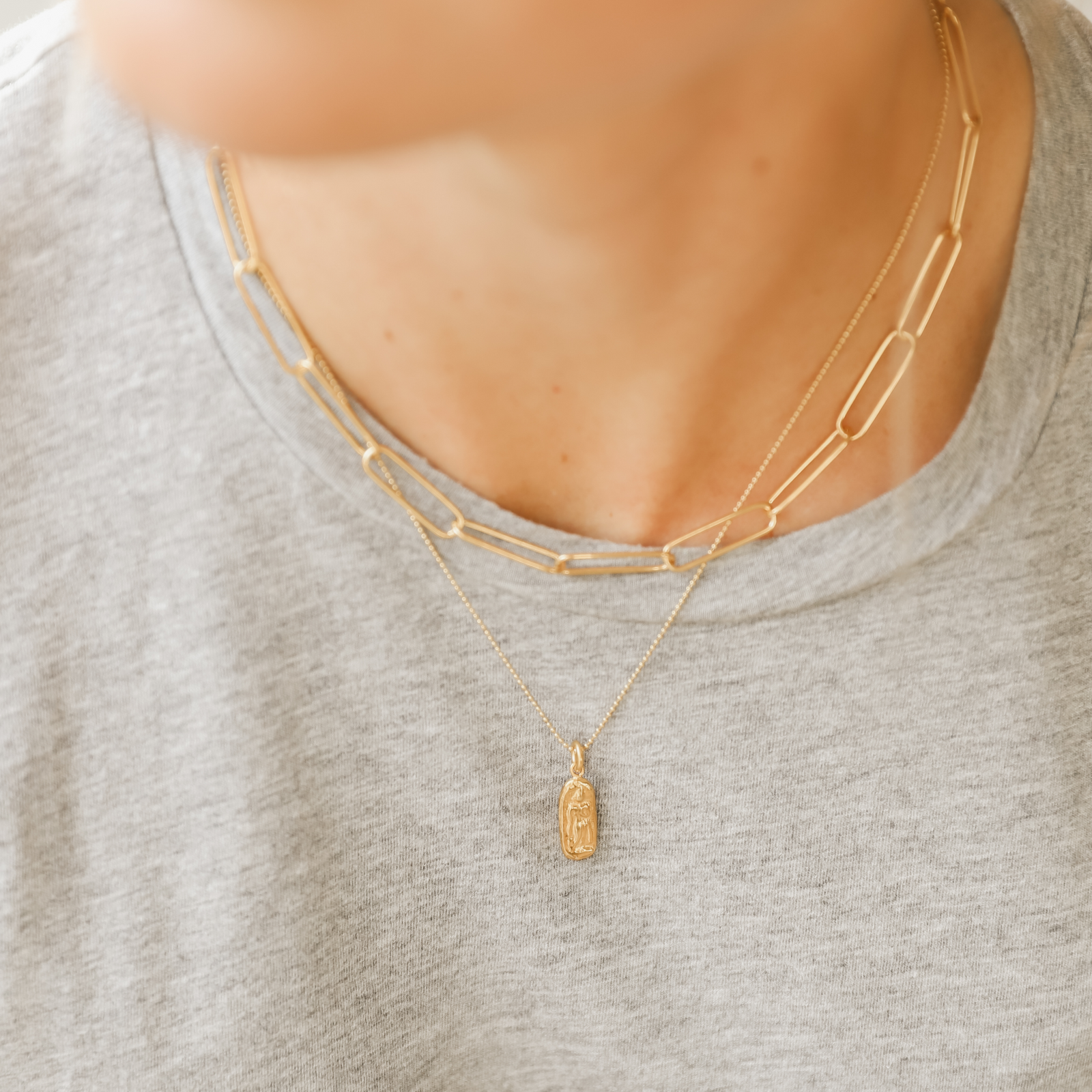 Simple, elegant, handmade fine paper clip chain necklace in 22K gold vermeil is 14.5" with 2" extender; features lobster clasp and hand-pressed Jai Style charm. Makes a bold style statement on its own and is perfect for layering.