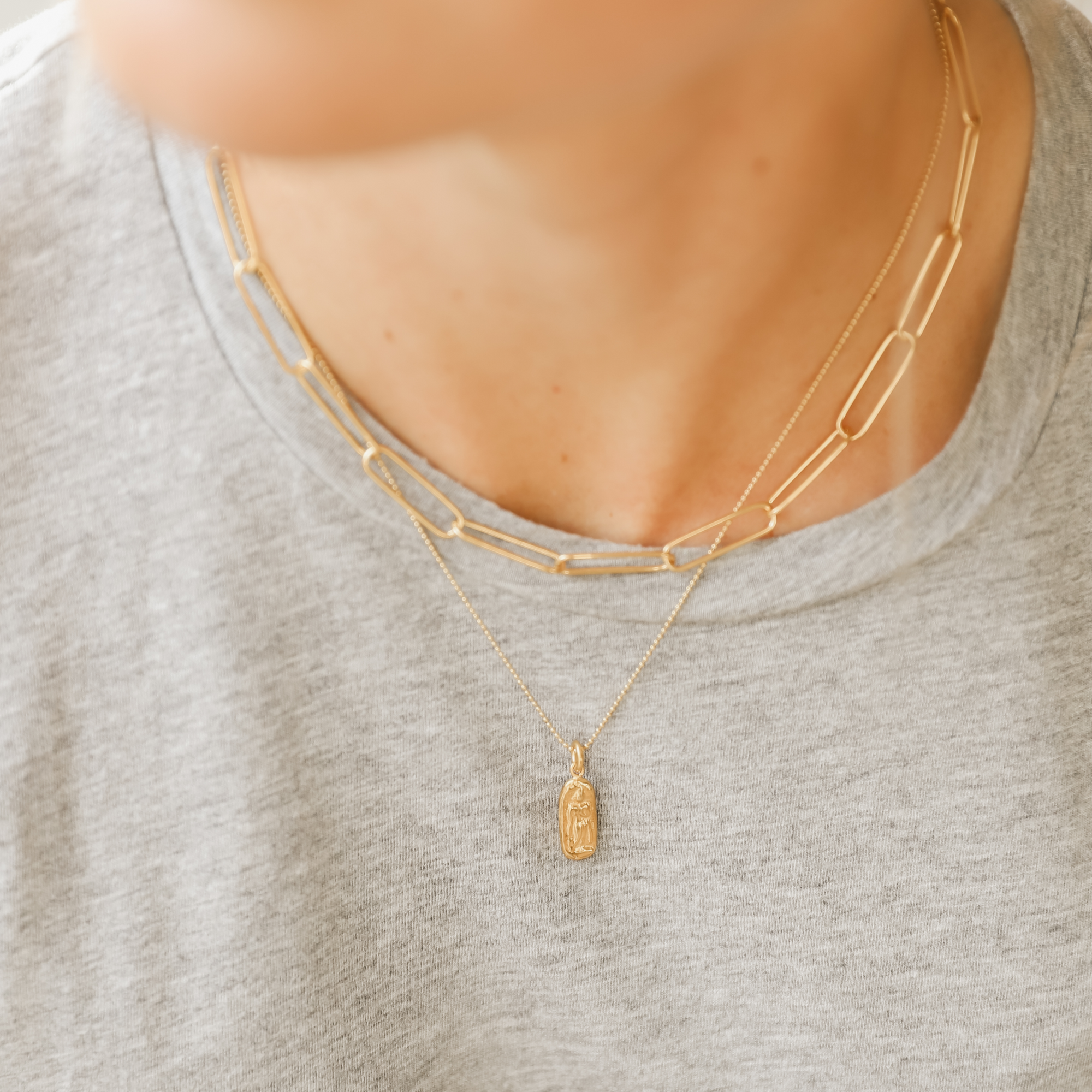 Simple, elegant, handmade fine paper clip chain necklace in 22K gold vermeil is 14.5" with 2" extender; features lobster clasp and hand-pressed Jai Style charm. Makes a bold style statement on its own and is perfect for layering.