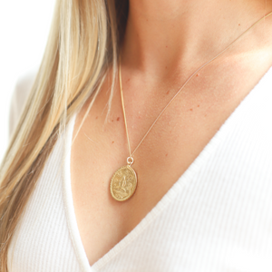 Beautiful traditional Thai oval amulet oval in 22K gold vermeil on 24" tiny curb chain adorned with hand-pressed Jai Style charm and lobster clasp. Wear it for beauty and purpose. Amulet features Buddha meditating in lotus position, inspiring mindfulness, purity, enlightenment, rebirth, and triumph over adversity.