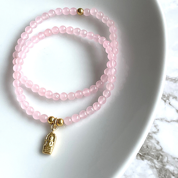 Beautiful polished 4mm Rose Quartz semi-precious stone bracelets. Adorned with gold vermeil ball beads. Also available with gold vermeil amulet hand-cast in .925 sterling silver and plated in 22K gold. Stretch bracelet measures 18.4 cm (7 1/4 in.).