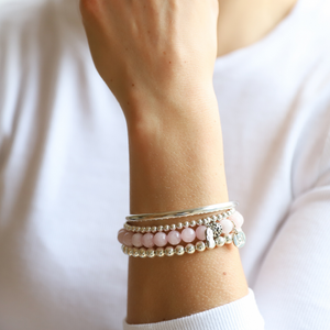 Beautiful sterling silver ball bead bracelet with amulet charm. Bracelet is hand-beaded with 4mm sterling silver beads; amulet is hand-cast in .925 sterling silver from authentic amulets sourced in Thai temples and made by Buddhist monks. Stretch bracelet measures 18.4 cm (7 1/4 in.).